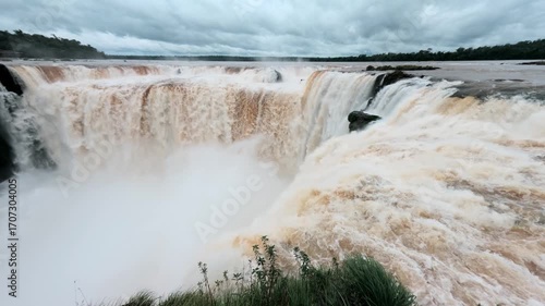 Iguazu Falls Devil Throat, world-famous waterfalls of Iguazu River on border Argentine province of Misiones and Brazil state Parana. Panoramic view of natural wonder. Brazilian wilderness landscape