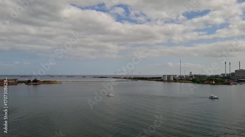 Copenhagen's Green Horizon: Modern Skyline and Offshore Wind Farm at Sunset