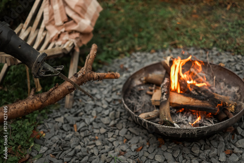 Wallpaper Mural Cutting firewood for a campfire Torontodigital.ca