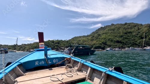 Wallpaper Mural Long-Tail Boat Approaching Harbor in Phuket, Thailand Torontodigital.ca