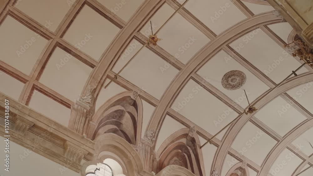 ornate vaulted ceiling with arches and painted patterns in church interior ornate vaulted ceiling with arches and painted patterns in church interior