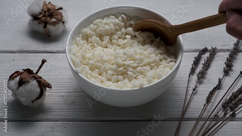 Granules of the soy wax in a bowl. Preparation for making candles. Candle making hobby.