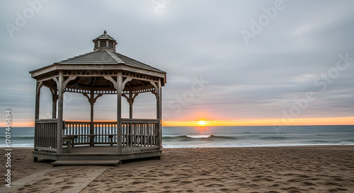 Scenic beach gazebo at sunrise, offering a tranquil and picturesque seascape backdrop