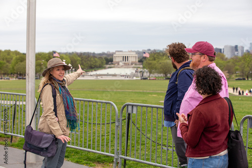 A woman pointing to the Lincoln memorial