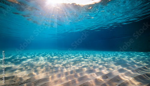 Underwater Ocean Floor With Sunlight Rays Shining Through The Water image photo