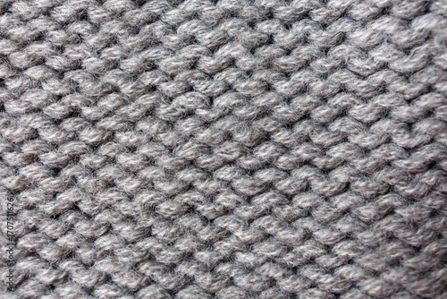 Photos Knitted wool fabric texture in gray color, close up of purl stitch pattern