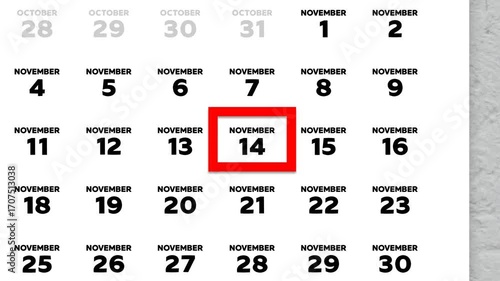 The date November 14th marked with a red cursor on the wall calendar 2025