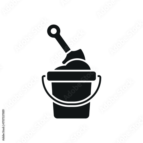 Bucket and spade with sand icon in glyph for simple summer and holiday graphics.