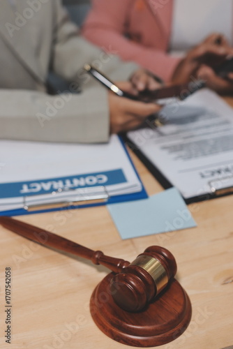 Consultation and conference of professional businesswoman and Male lawyers working and discussion having at law firm in office. Concepts of law, Judge gavel with scales of justice