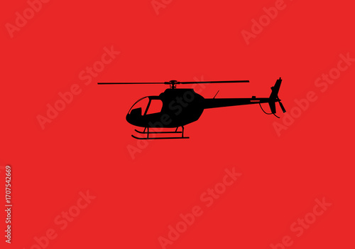 A black helicopter silhouette on a solid red background