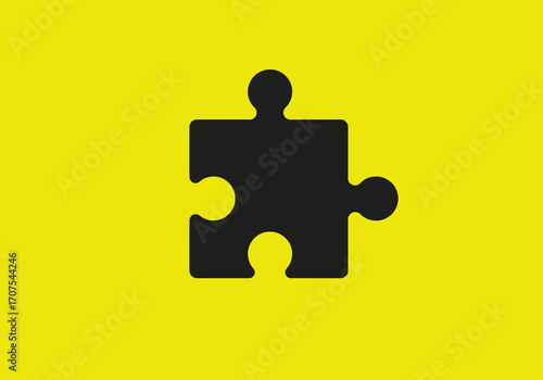 Black jigsaw puzzle piece against a yellow background Simple and graphic