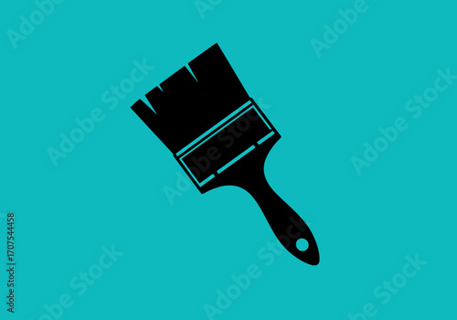 Black paintbrush with a hole in the handle against a teal background