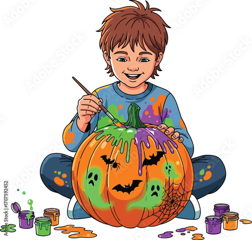 Happy boy paints a Halloween pumpkin with ghosts, bats, and spiderwebs for a festive holiday vibe