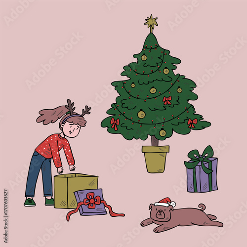 Girl in Christmas clothes opens a present