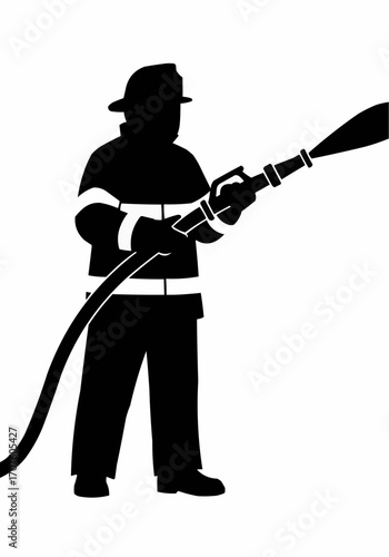 Silhouette of a firefighter in action, bravely battling a fire with a water hose.