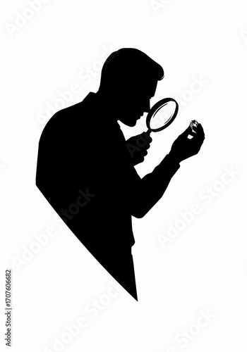 A silhouette of a man carefully examining an object with a magnifying glass.