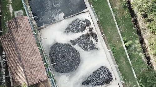 Contaminated wastewater or leachate flowing from a landfill, showing the impact of waste disposal on the environment and water pollution risks.