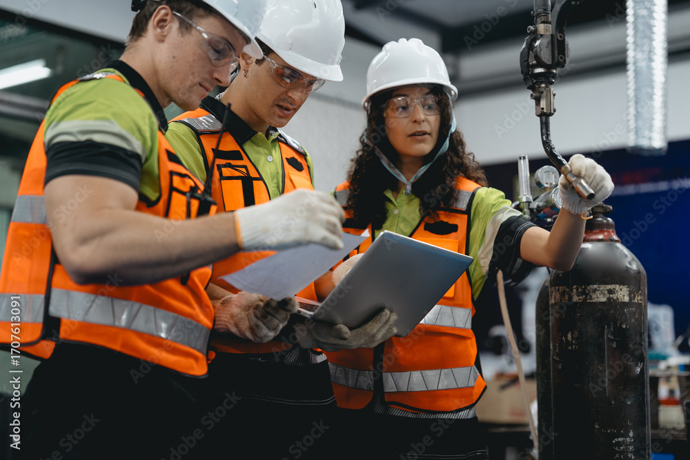 Obraz premium Diverse group of latin engineer working on AI technology in robotics electronics engineering laboratory. Hispanic technician team and colleague research in robot machine futuristic automated control.