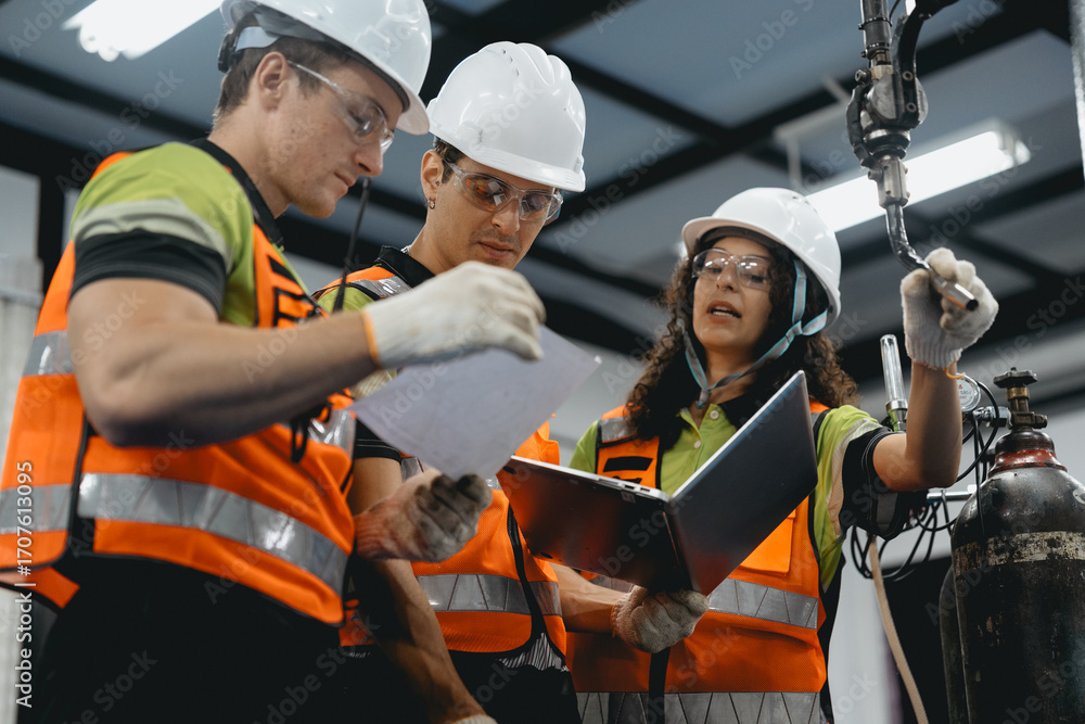 Obraz premium Diverse group of latin engineer working on AI technology in robotics electronics engineering laboratory. Hispanic technician team and colleague research in robot machine futuristic automated control.