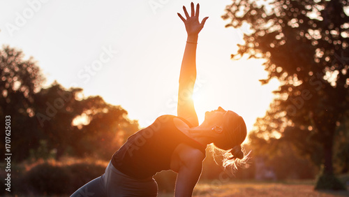 Wallpaper Mural Woman practicing yoga and stretching in the park on a hot sunny summertime day. Torontodigital.ca