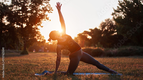 Wallpaper Mural Woman practicing yoga and stretching in the park on a hot sunny summertime day. Torontodigital.ca