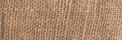 Hessian sackcloth woven texture pattern background in light yellow gold cream color . Texture of burlap