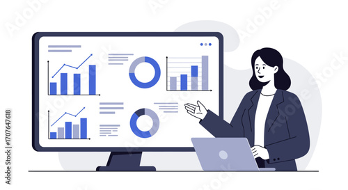 A businesswoman giving a presentation, pointing to data charts and graphs on a large computer monitor.