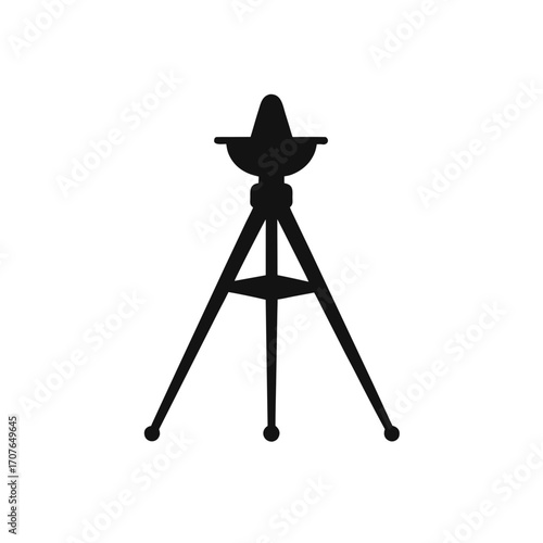 Silhouette of a tripod with a lamp on top on transparent background