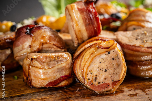 Pork medallions wrapped in bacon closeup.