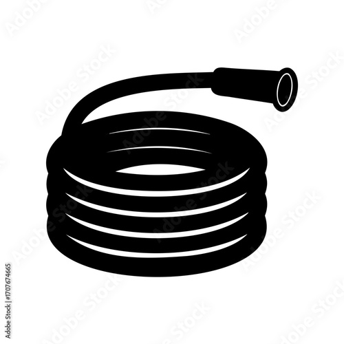 Coiled black garden hose with nozzle ready for watering plants or grass