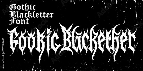 Gothic blackletter font design with sharp spikes and grunge texture on black background