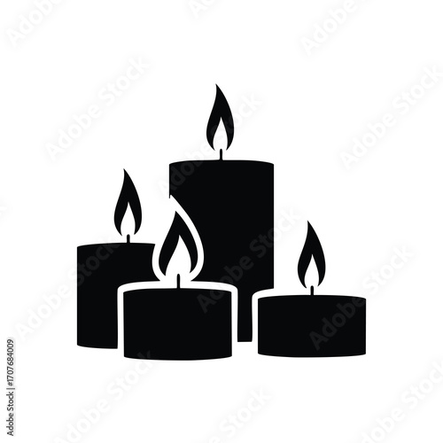 Four lit black candles on white background Keywords: candle, candles, flame, fire, light