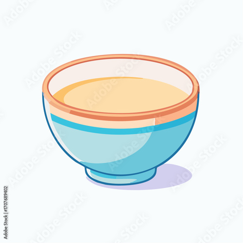 A bowl of light yellow liquid, possibly soup or broth, in a light blue bowl with orange and teal stripes.