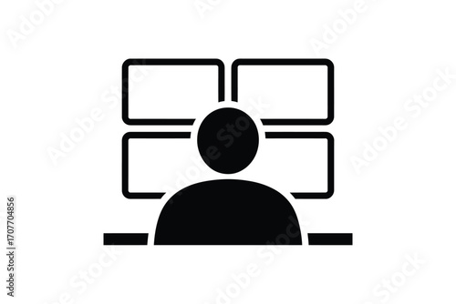 Person monitoring multiple screens in a control room setting