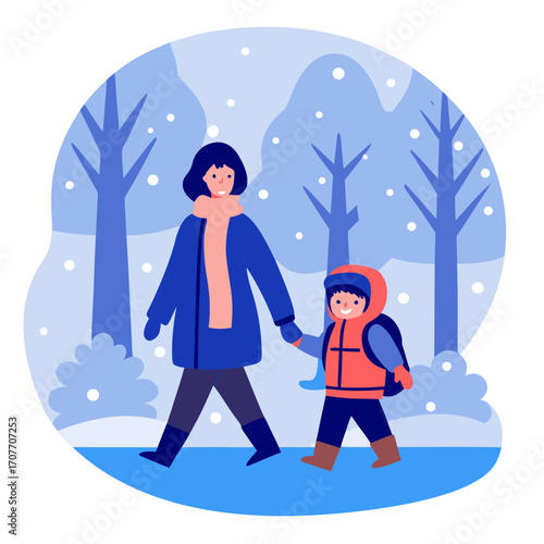 Mother walking with child to school in winter snowy landscape  