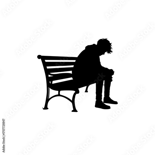 A black silhouette of a young man sitting slumped on a park bench, head bowed.