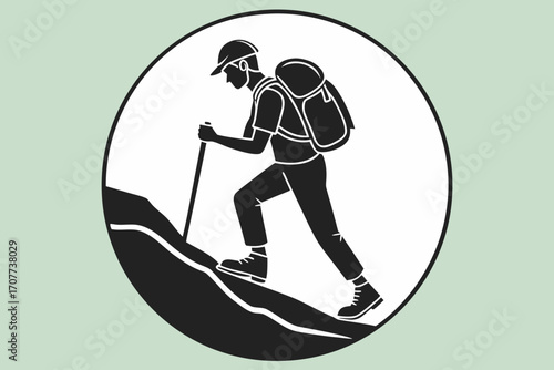 Silhouette of a Hiker Ascending a Mountain Trail.