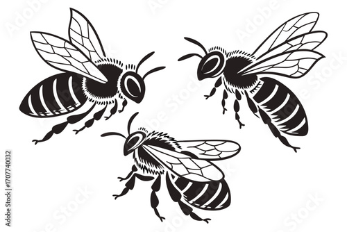 Three Stylized Black and White Bees in Flight.