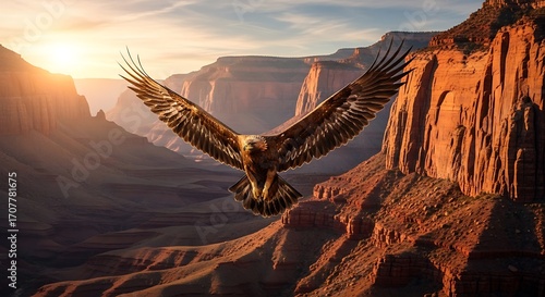 Majestic golden eagle soars above a breathtaking canyon landscape at sunrise.