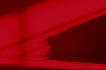 Abstract red background with shadow light effect on wall studio interior for product display Chinese New Year celebration, Christmas theme,Valentine’s Day design,festive decoration,modern marketing