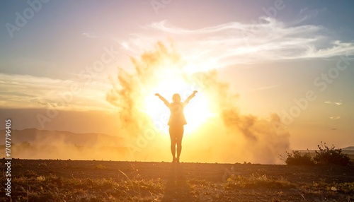 A silhouette of a person with arms raised against a bright, sunlit backdrop and a burst of light