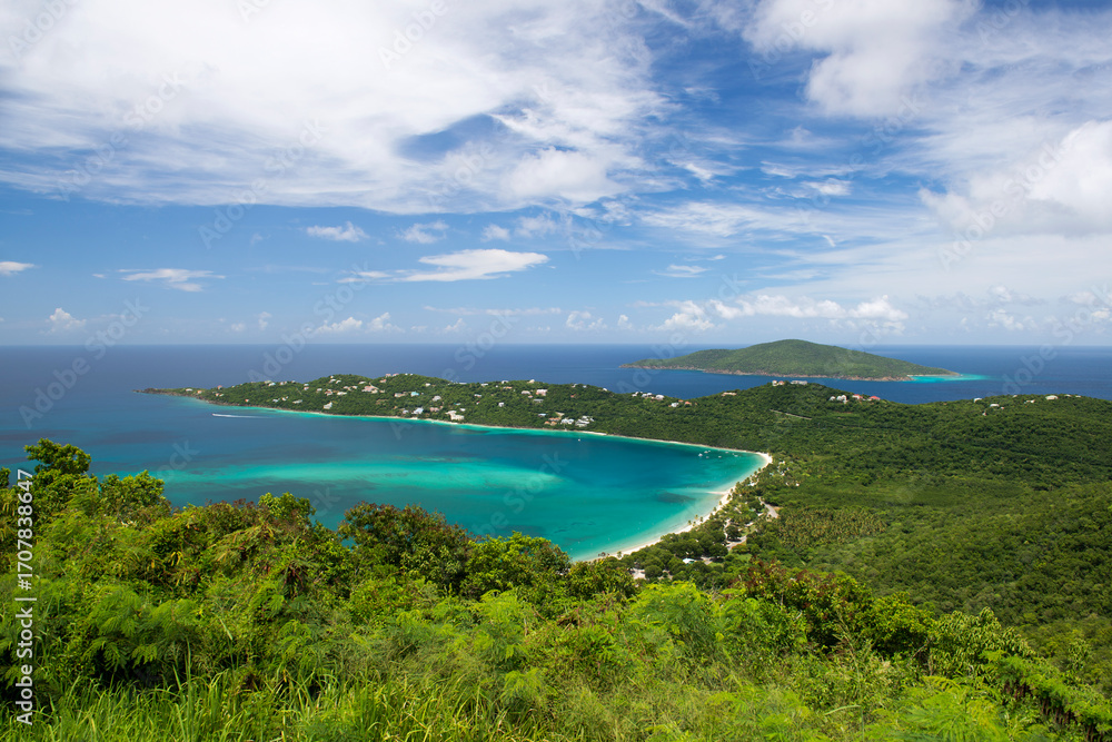 Fototapeta premium Aerial view of Magens Bay Beach in St. Thomas, US Virgin Islands, with turquoise waters, white sand and lush green hills, perfect tropical escape