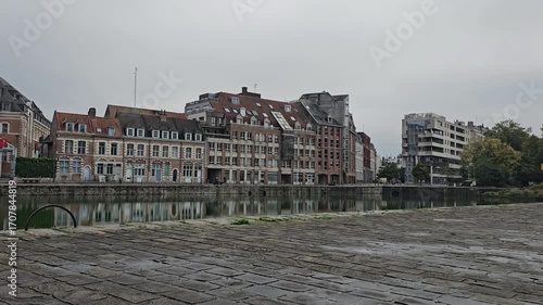 Lille, France - 17 October 2024 - Scenic Reflection of Historic Buildings on a Tranquil Waterway at Le quai du Wault ( Le quai du Wault ) one of the two old ports of Lille, France