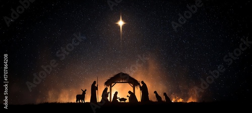 Nativity scene with the holy family in a manger under the star of bethlehem at night