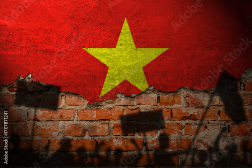 Vietnam flag painting on brick wall and Protesters shadow