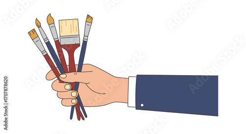 a hand holding various paint brushes ready for art
