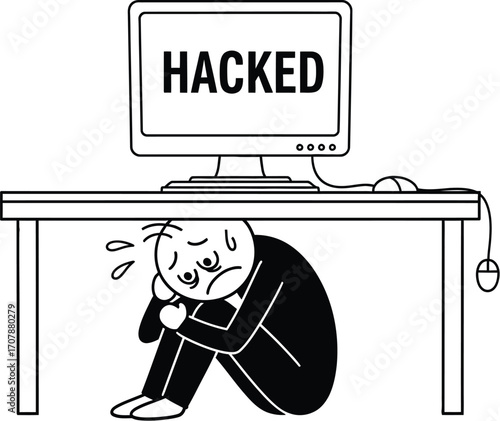 Scared person hiding under desk as computer screen displays 'HACKED'