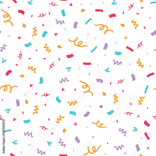 Colorful confetti and streamers scattered on white ground