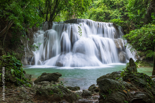 Serene tropical waterfall in lush green forest National Park, Huay Mae Khamin, Tier 3 Wang Na Pha, Kanchanaburi, Thailand