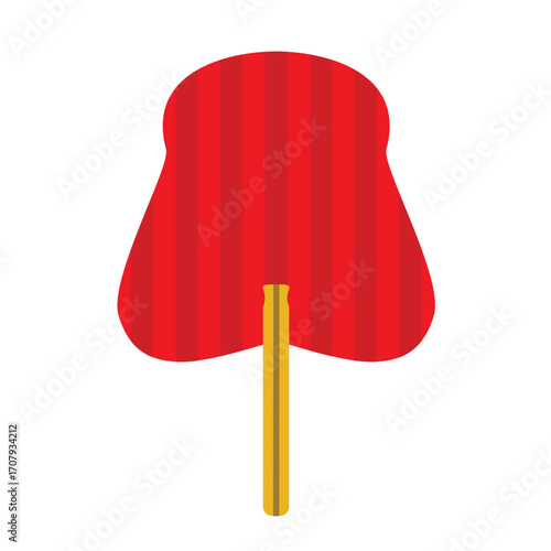 Vibrant red jelly-like dessert with a yellow spoon resting beside it on a textured surface
